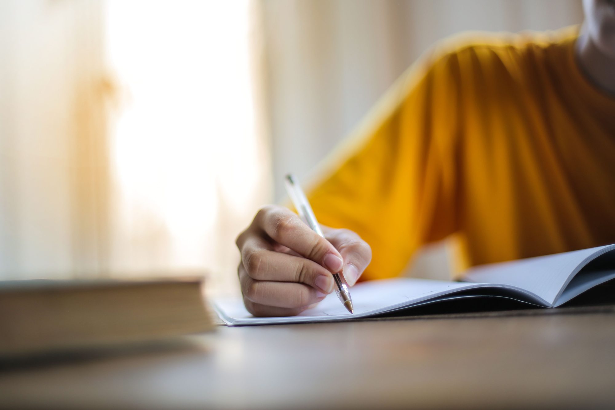 A writer working through a draft by hand